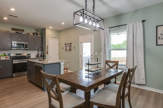 1017 Village Ct, Burns, TN 37029 - dining area featuring light wood finished floors, recessed lighting, and baseboards