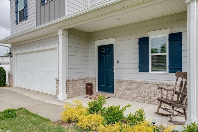 1017 Village Ct, Burns, TN 37029 - doorway to property featuring board and batten siding and an attached garage