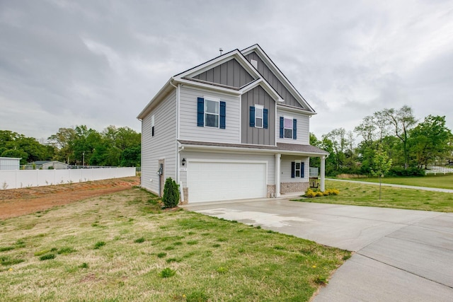 1017 Village Ct, Burns, TN 37029 - view of front of property with board and batten siding, a garage, and concrete driveway