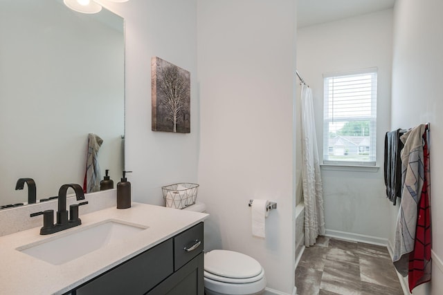 1017 Village Ct, Burns, TN 37029 - bathroom with toilet, vanity, shower / tub combo, and baseboards