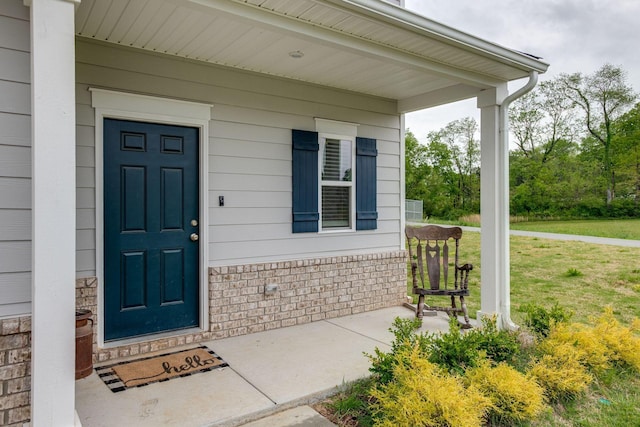 1017 Village Ct, Burns, TN 37029 - entrance to property featuring a porch and a lawn