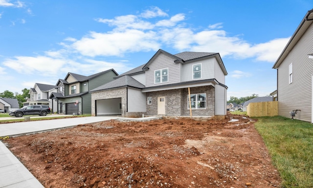 961 Isaac Dr, Clarksville, TN 37040 - view of front of house with concrete driveway, fence, brick siding, a residential view, and a garage