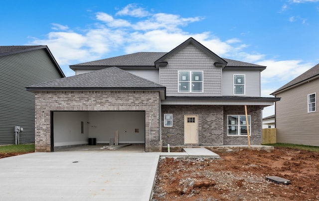 961 Isaac Dr, Clarksville, TN 37040 - view of front facade featuring concrete driveway, an attached garage, brick siding, and a shingled roof