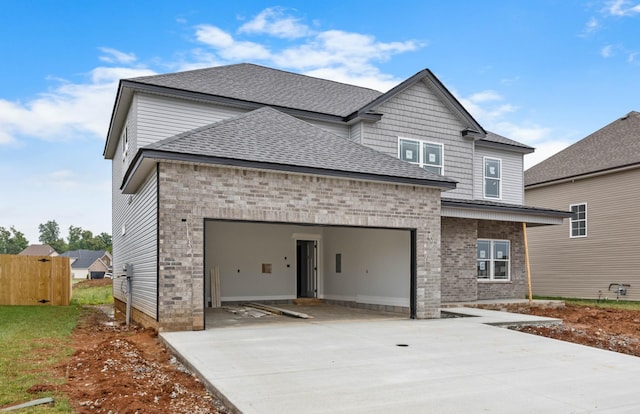 961 Isaac Dr, Clarksville, TN 37040 - view of front facade featuring concrete driveway, a shingled roof, a garage, brick siding, and fence
