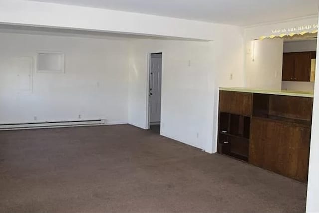 149 Hollywood Blvd, Gallatin, TN 37066 - unfurnished room featuring a baseboard heating unit and dark carpet