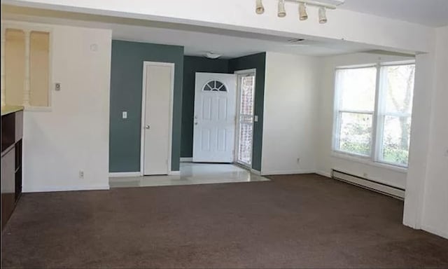 149 Hollywood Blvd, Gallatin, TN 37066 - unfurnished living room with a baseboard radiator, carpet flooring, and baseboards