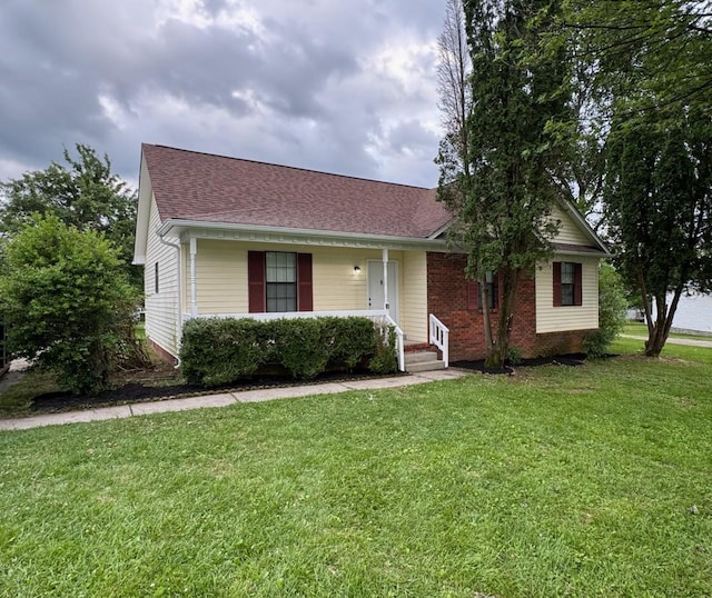 6109 Ebenezer Rd, Greenbrier, TN 37073 - view of front facade featuring a front yard, covered porch, and a shingled roof