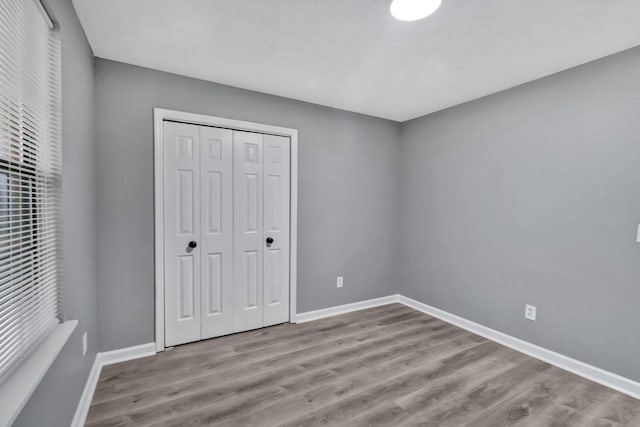 6109 Ebenezer Rd, Greenbrier, TN 37073 - unfurnished bedroom featuring wood finished floors, baseboards, and a closet