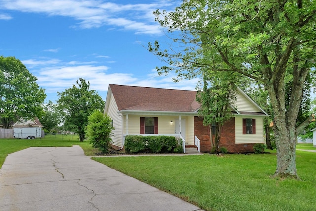 6109 Ebenezer Rd, Greenbrier, TN 37073 - view of front of house featuring covered porch, a front lawn, roof with shingles, and concrete driveway
