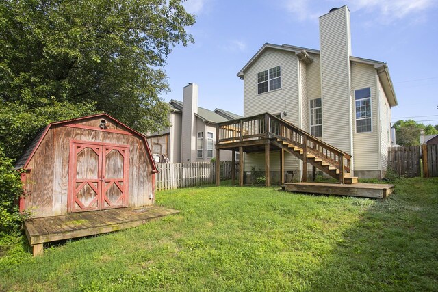 5943 Colchester Dr, Hermitage, TN 37076 - back of property with stairway, a chimney, and a wooden deck