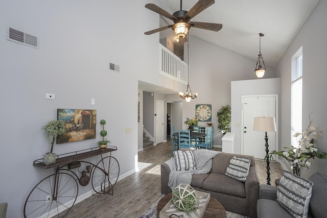 5943 Colchester Dr, Hermitage, TN 37076 - living area with high vaulted ceiling, wood finished floors, baseboards, ceiling fan, and stairway