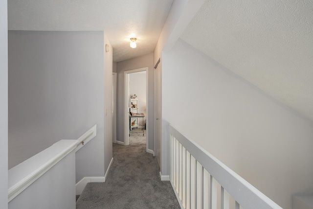 5943 Colchester Dr, Hermitage, TN 37076 - hall featuring an upstairs landing, a textured ceiling, carpet flooring, and baseboards
