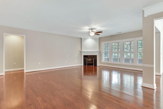 221 Antebellum Ln, Mount Juliet, TN 37122 - unfurnished living room featuring ceiling fan, wood finished floors, baseboards, and a fireplace with flush hearth