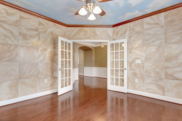 221 Antebellum Ln, Mount Juliet, TN 37122 - empty room with french doors, arched walkways, ceiling fan, wood finished floors, and crown molding