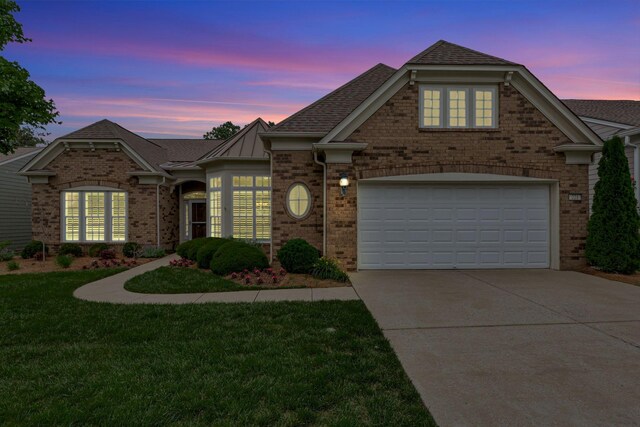 221 Antebellum Ln, Mount Juliet, TN 37122 - view of front of house with concrete driveway, brick siding, a yard, and a garage