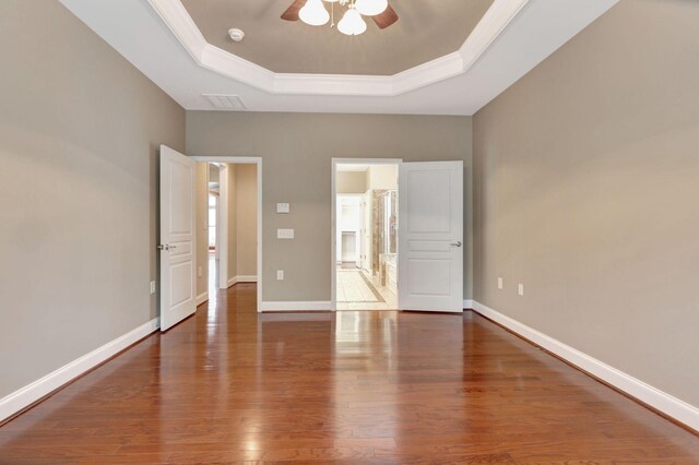 221 Antebellum Ln, Mount Juliet, TN 37122 - unfurnished bedroom with a tray ceiling, wood finished floors, crown molding, baseboards, and a ceiling fan