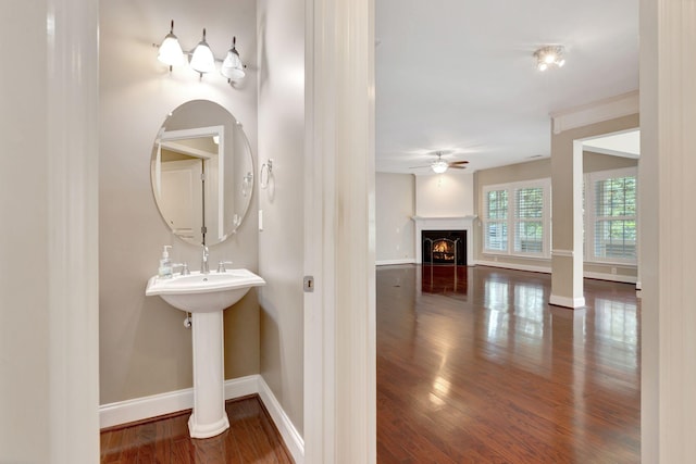 221 Antebellum Ln, Mount Juliet, TN 37122 - bathroom with baseboards, wood finished floors, ceiling fan, and a lit fireplace