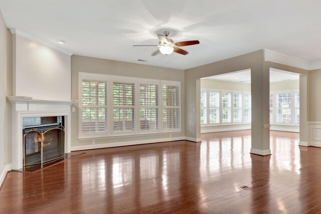 221 Antebellum Ln, Mount Juliet, TN 37122 - unfurnished living room with a ceiling fan, a fireplace with flush hearth, wood finished floors, baseboards, and crown molding