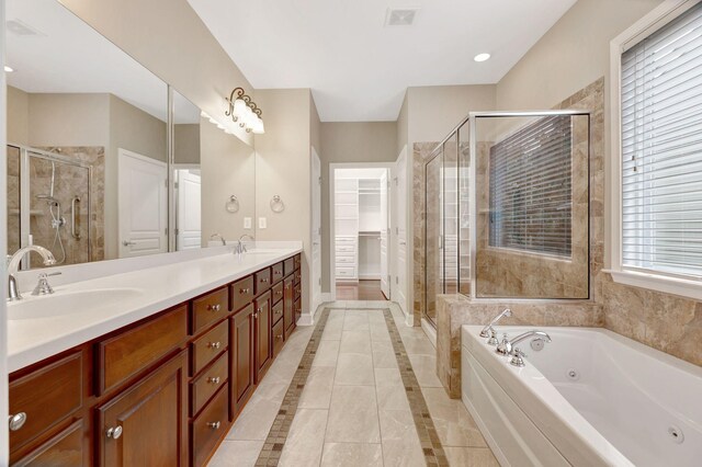 221 Antebellum Ln, Mount Juliet, TN 37122 - bathroom featuring a shower stall, a whirlpool tub, double vanity, a spacious closet, and baseboards