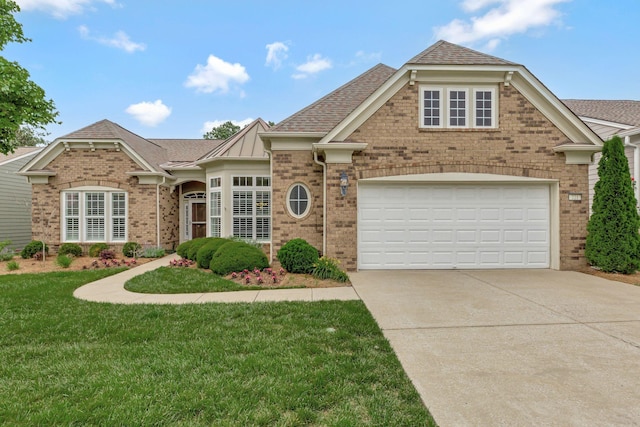 221 Antebellum Ln, Mount Juliet, TN 37122 - view of front of house featuring brick siding, driveway, a front yard, and roof with shingles