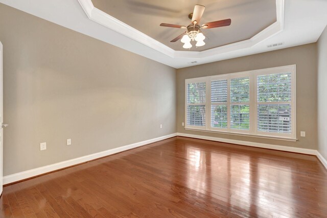 221 Antebellum Ln, Mount Juliet, TN 37122 - spare room with a tray ceiling, a ceiling fan, wood finished floors, baseboards, and ornamental molding