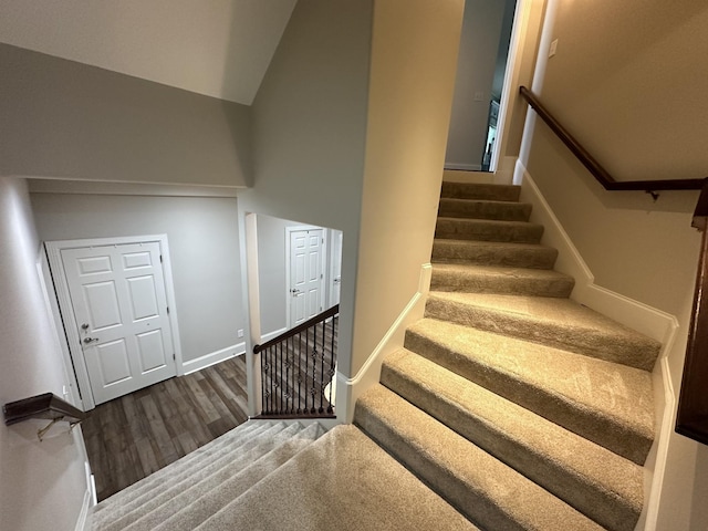 9619 Deer Track Ct, Brentwood, TN 37027 - stairs featuring wood finished floors, baseboards, and a high ceiling