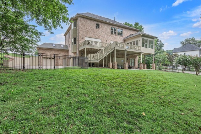 9619 Deer Track Ct, Brentwood, TN 37027 - back of house featuring a sunroom, stairway, a wooden deck, and brick siding