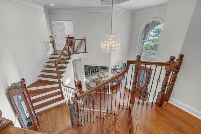 9619 Deer Track Ct, Brentwood, TN 37027 - staircase featuring wood finished floors, crown molding, a chandelier, and baseboards