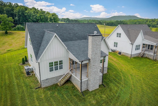 633 Post Office Rd, Rock Island, TN 38581 - back of house with board and batten siding, a chimney, roof with shingles, and stairs