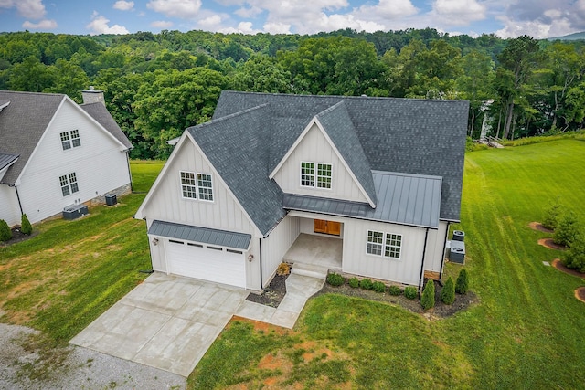 633 Post Office Rd, Rock Island, TN 38581 - modern farmhouse featuring a standing seam roof, roof with shingles, a metal roof, covered porch, and driveway