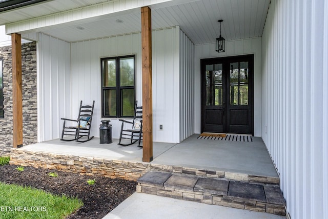 355 Shadows Lawn Dr, Athens, TN 37303 - entrance to property featuring french doors, covered porch, and stone siding