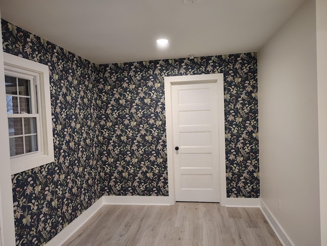 1305 Ellington Dr, Lafayette, TN 37083 - unfurnished room with wood finished floors, wallpapered walls, and baseboards
