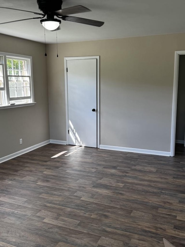 1307 Ellington Dr, Lafayette, TN 37083 - empty room featuring ceiling fan, baseboards, and dark wood-type flooring