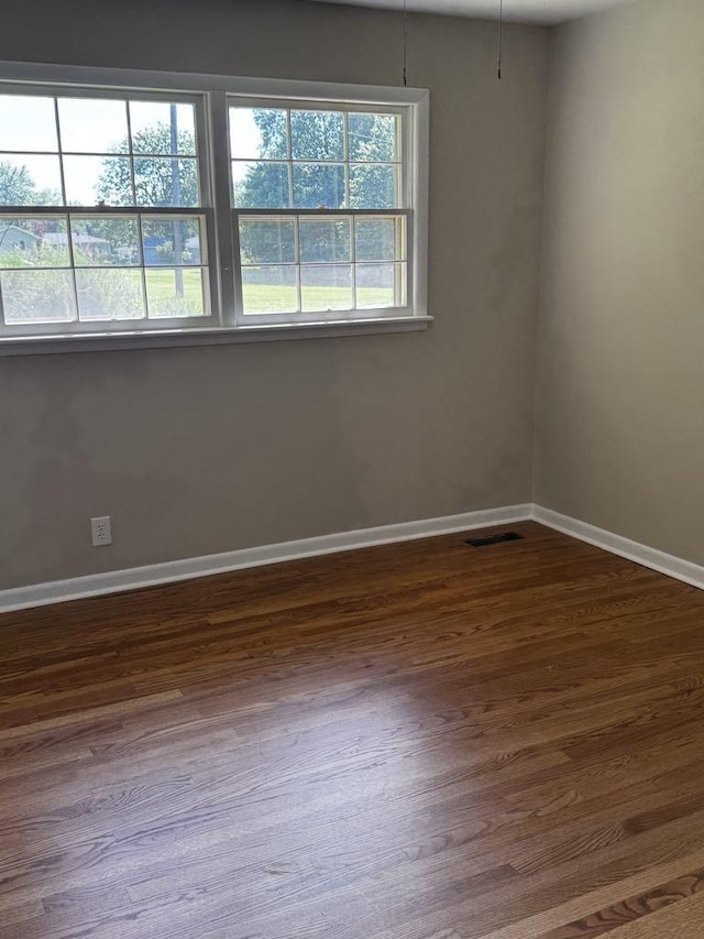 1307 Ellington Dr, Lafayette, TN 37083 - empty room featuring dark wood-type flooring and baseboards