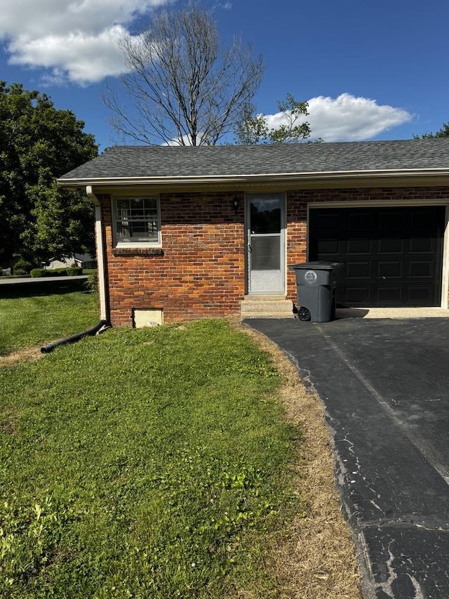 1307 Ellington Dr, Lafayette, TN 37083 - ranch-style home with an attached garage, driveway, brick siding, a front lawn, and a shingled roof