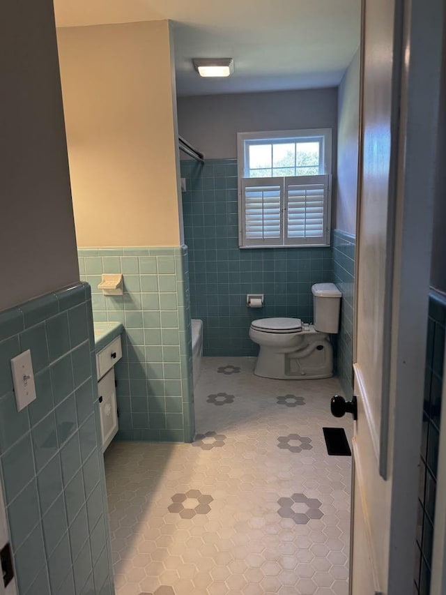 1307 Ellington Dr, Lafayette, TN 37083 - bathroom with tile walls, toilet, tile patterned flooring, vanity, and wainscoting