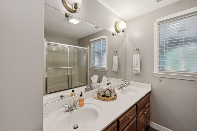 503 Dawn Pl, Lebanon, TN 37087 - full bathroom featuring a shower stall, plenty of natural light, double vanity, and baseboards