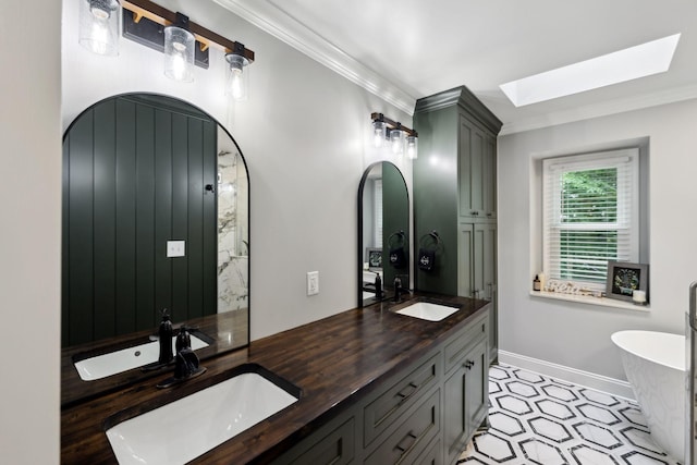 503 Dawn Pl, Lebanon, TN 37087 - bathroom with a skylight, crown molding, a soaking tub, double vanity, and baseboards