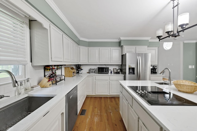 503 Dawn Pl, Lebanon, TN 37087 - kitchen featuring black appliances, a sink, white cabinetry, and crown molding