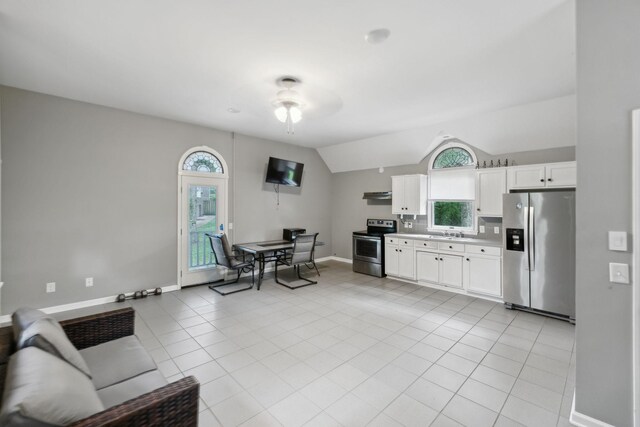 503 Dawn Pl, Lebanon, TN 37087 - kitchen featuring stainless steel appliances, ceiling fan, vaulted ceiling, white cabinets, and baseboards