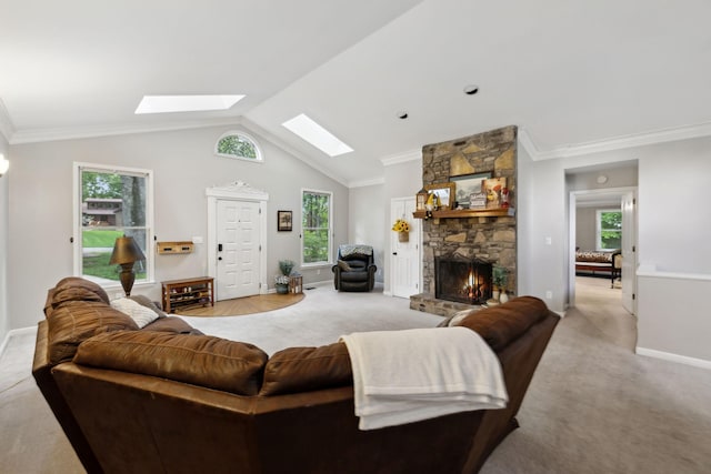 503 Dawn Pl, Lebanon, TN 37087 - living area featuring a skylight, light carpet, a stone fireplace, baseboards, and vaulted ceiling