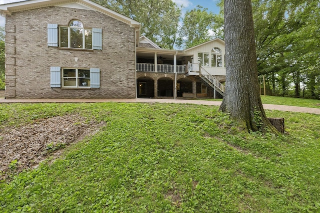 503 Dawn Pl, Lebanon, TN 37087 - back of house featuring a ceiling fan, stairway, a yard, brick siding, and a patio area