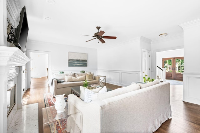5313 Curlybark Pl, Brentwood, TN 37027 - living area with french doors, ceiling fan, a premium fireplace, ornamental molding, and wood finished floors
