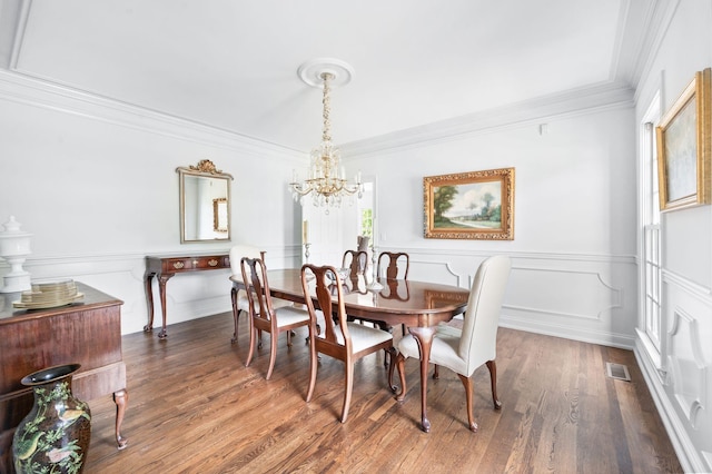 5313 Curlybark Pl, Brentwood, TN 37027 - dining space featuring a chandelier, ornamental molding, wood finished floors, and a wainscoted wall