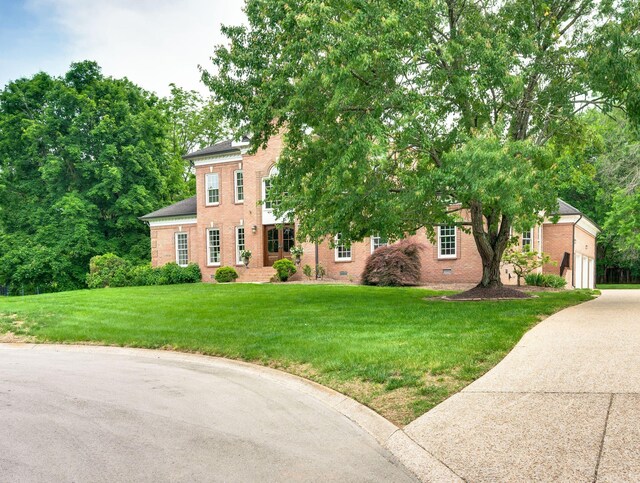 5313 Curlybark Pl, Brentwood, TN 37027 - view of front of property with brick siding, concrete driveway, and a front yard
