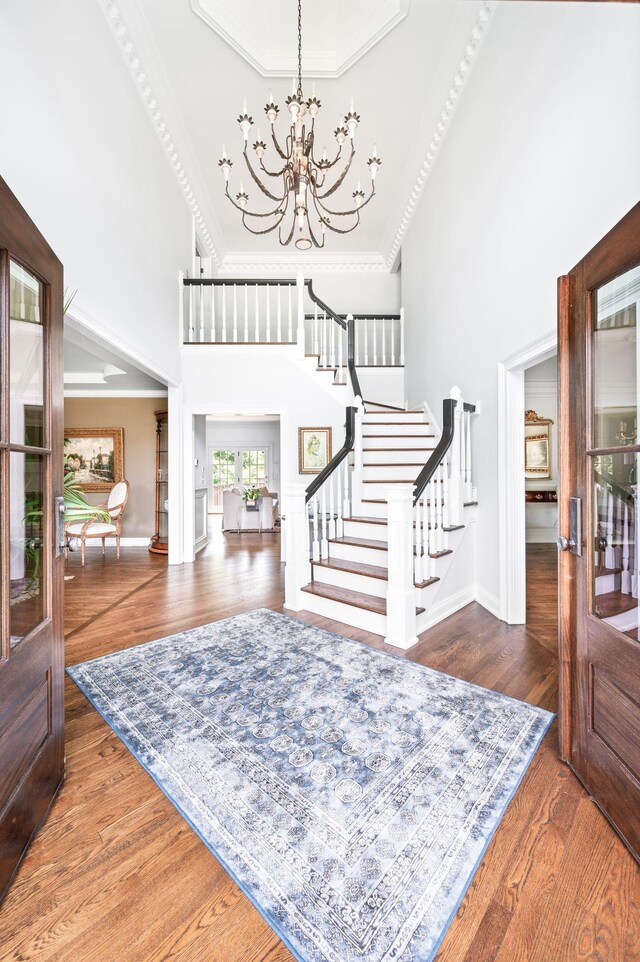 5313 Curlybark Pl, Brentwood, TN 37027 - foyer entrance featuring stairs, a towering ceiling, a chandelier, ornamental molding, and baseboards