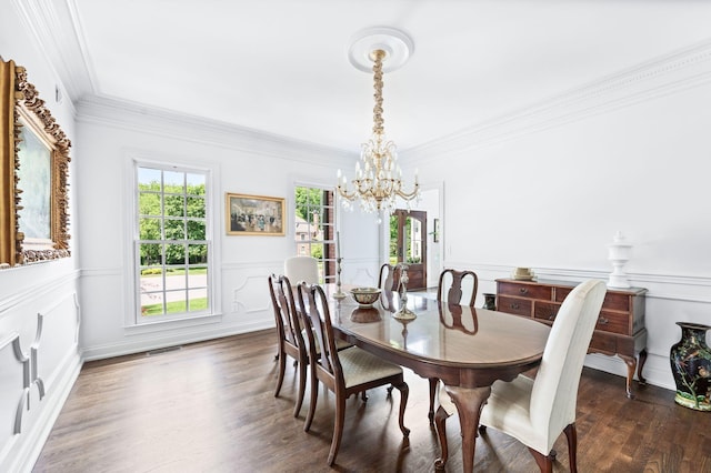 5313 Curlybark Pl, Brentwood, TN 37027 - dining room featuring a chandelier, a wainscoted wall, ornamental molding, wood finished floors, and a decorative wall