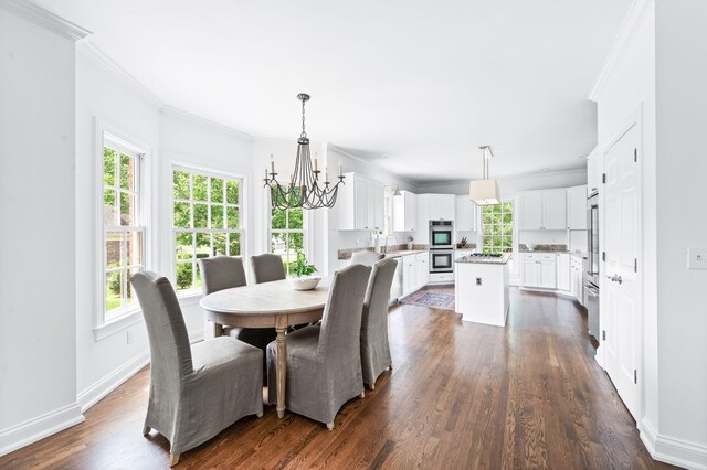 5313 Curlybark Pl, Brentwood, TN 37027 - dining area featuring crown molding, plenty of natural light, a chandelier, and dark wood-style floors