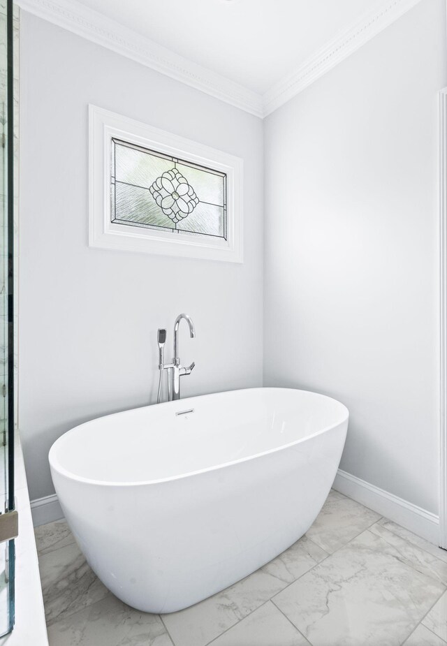 5313 Curlybark Pl, Brentwood, TN 37027 - bathroom with marble finish floors, crown molding, a soaking tub, and baseboards