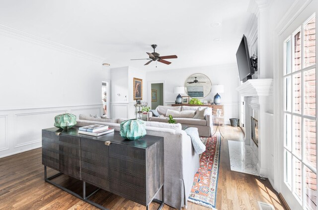 5313 Curlybark Pl, Brentwood, TN 37027 - living area with ceiling fan, wood finished floors, a premium fireplace, wainscoting, and ornamental molding